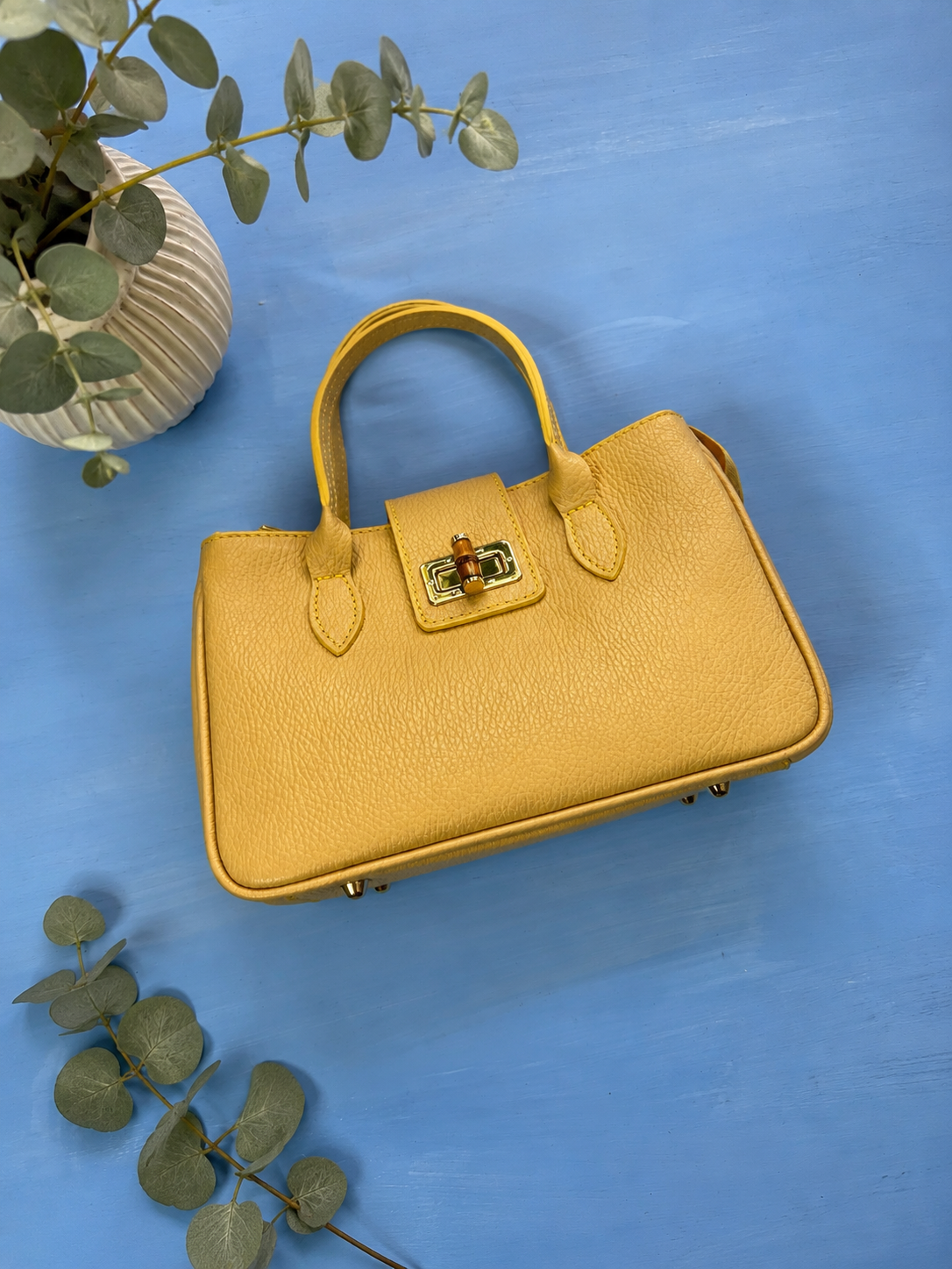 BOLSO EN CUERO AMARILLO Y AZUL BEBE